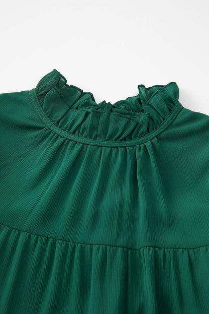 Vestido verde con mangas abullonadas y cuello simulado con nudo en la espalda