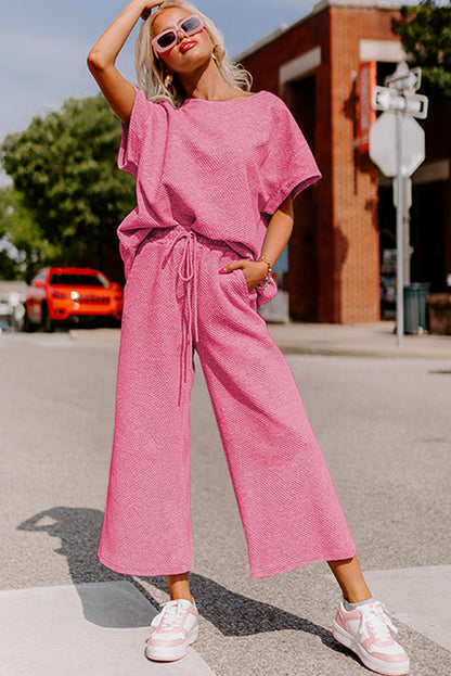 Conjunto de camiseta holgada con textura rosa fresa y pantalones con cordón