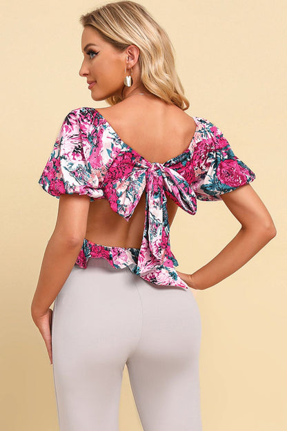 Blusa peplum corta con lazo floral