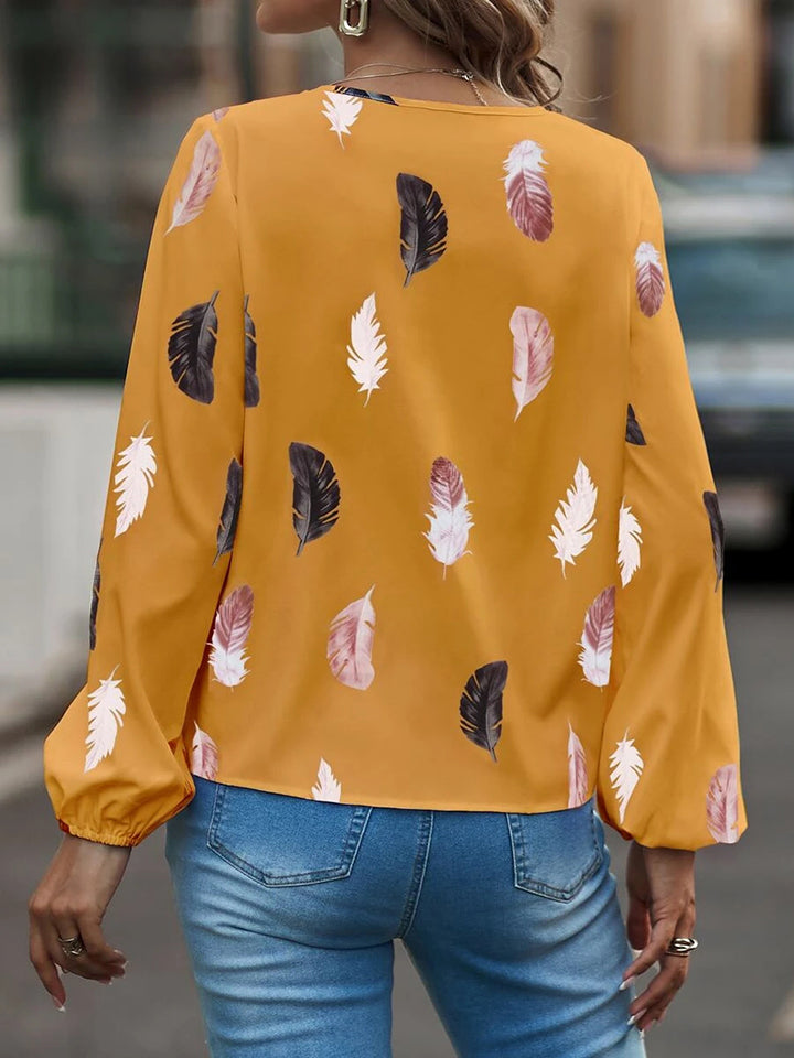 Blusa estampada de manga larga con cuello con muescas