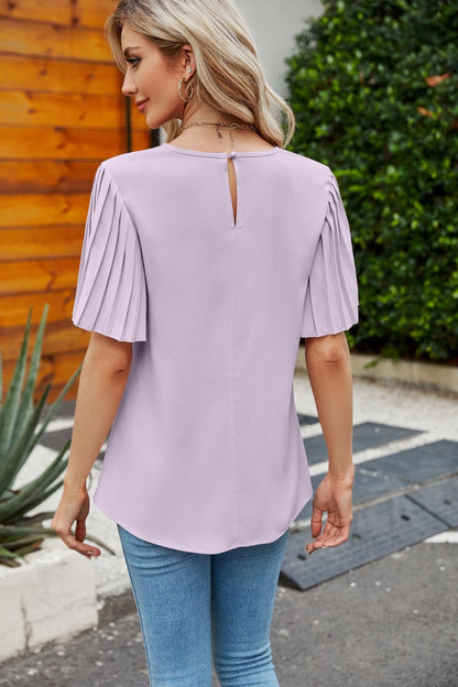 Blouse plissée à manches flottantes et col rond