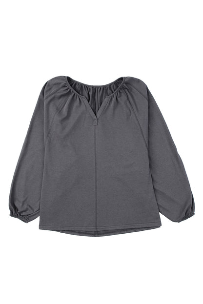 Blouse à manches ballon et col cranté