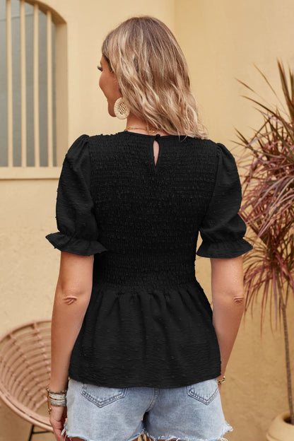 Blusa peplum fruncida con lunares suizos