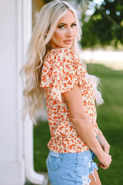 Blusa floral con cuello redondo y manga acampanada