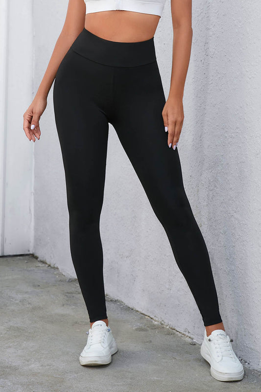 Leggings negros de cintura alta con control de barriga cruzados