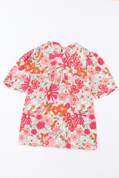 Blouse nouée à manches bouffantes et fleurs