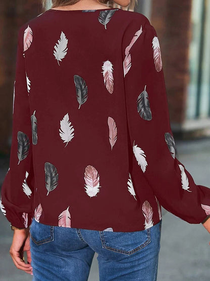 Blusa estampada de manga larga con cuello con muescas