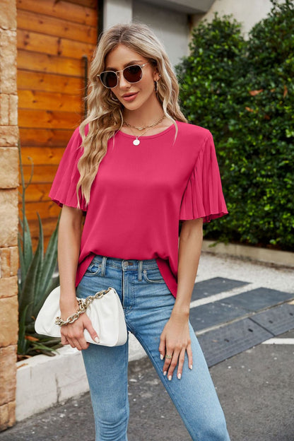 Blusa plisada con cuello redondo y mangas acampanadas