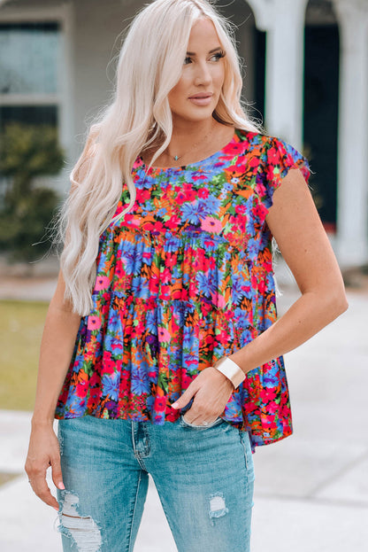 Blusa floral con cuello redondo y ribete de volantes