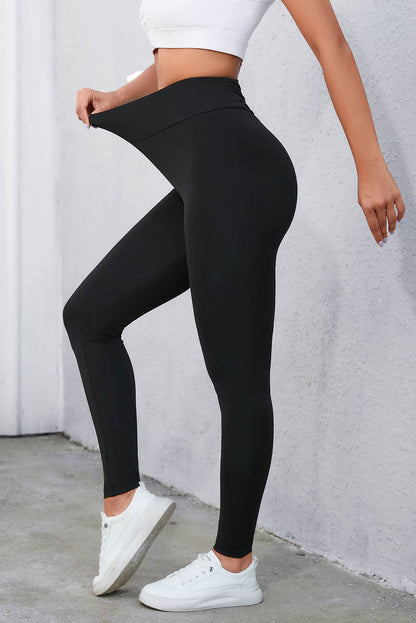 Leggings negros de cintura alta con control de barriga cruzados