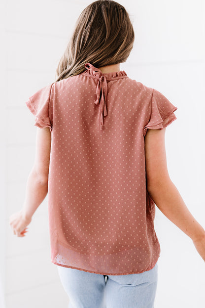 Blouse smockée à pois et manches flottantes