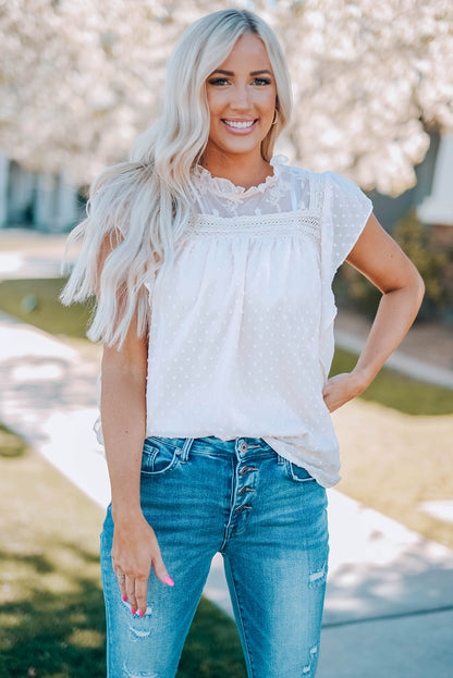 Blouse à col volanté et à pois suisses