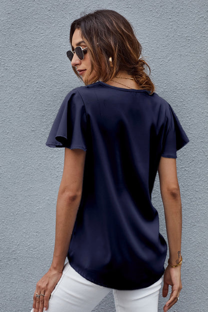 Blusa con mangas acampanadas y cuello en V