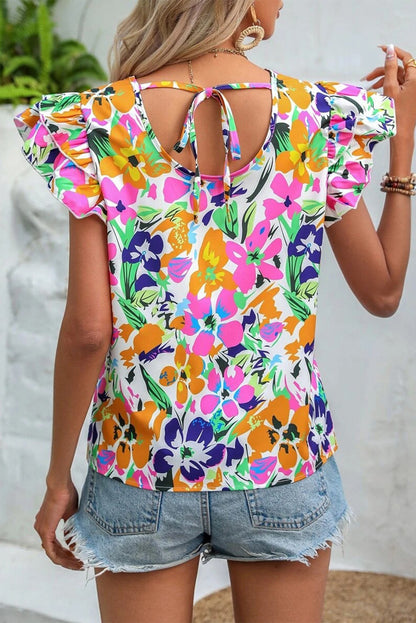 Blouse florale à manches flottantes et nouée au dos