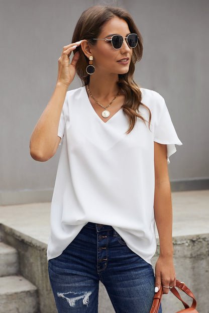 Blusa con mangas acampanadas y cuello en V