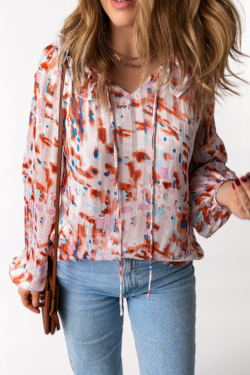 Blusa estampada con mangas globo y volantes