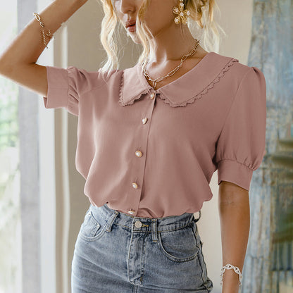 Blouse à col poupée et manches bouffantes