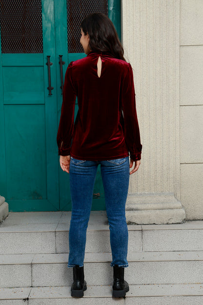 Blouse en velours à manches bouffantes et découpes