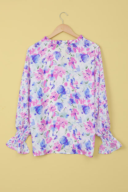 Blusa con mangas con volante y cuello anudado con ribete de volantes florales