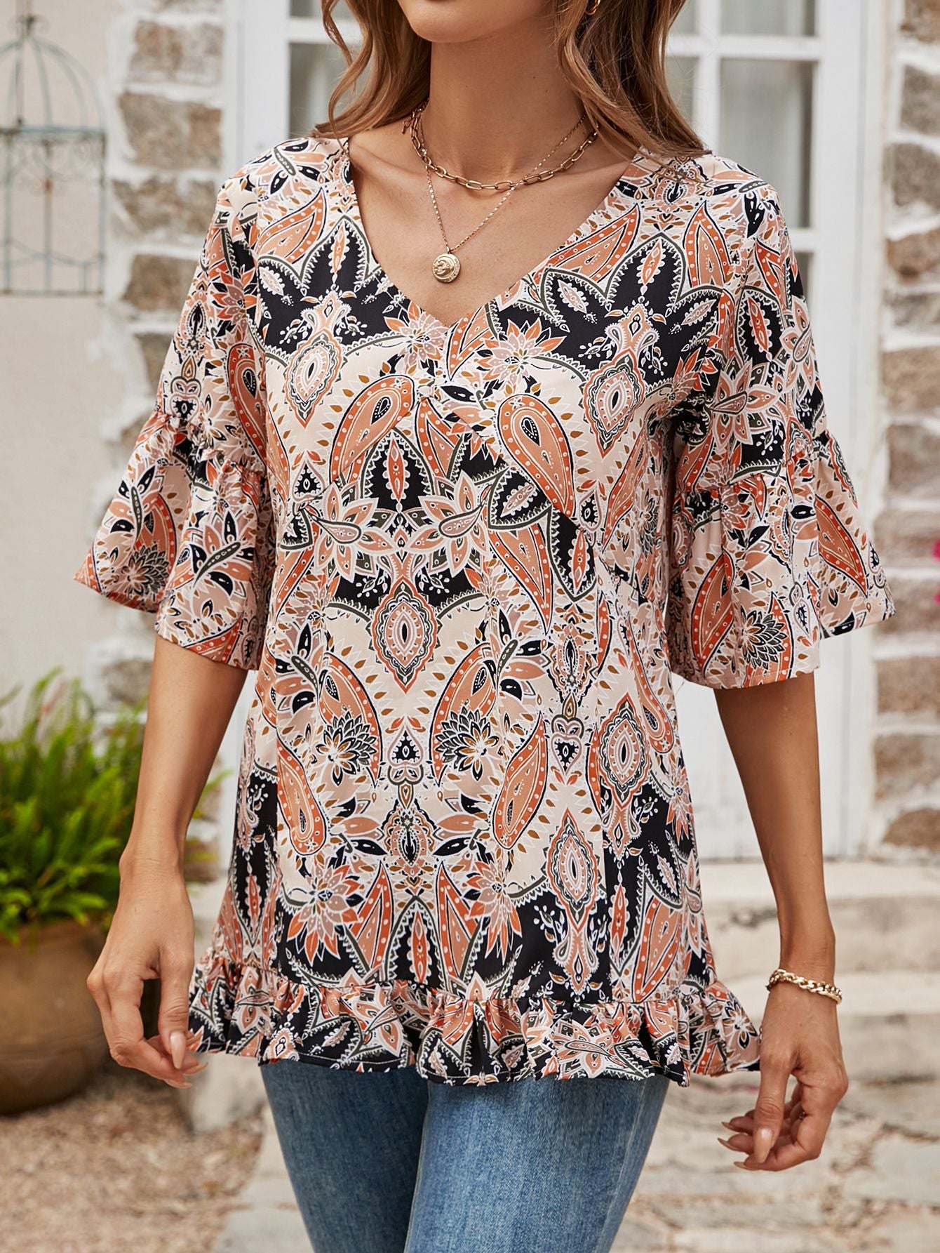 Blusa estampada con dobladillo con volantes y mangas con volantes