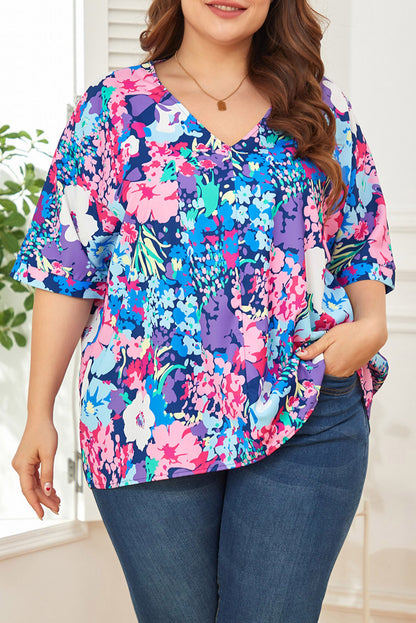 Blusa floral con cuello en V y costura central