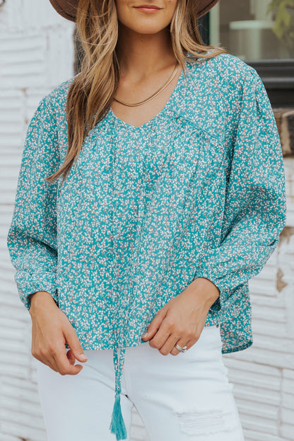 Blusa asimétrica con borlas y estampado floral de florecitas