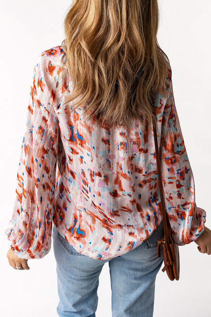 Blusa estampada con mangas globo y volantes