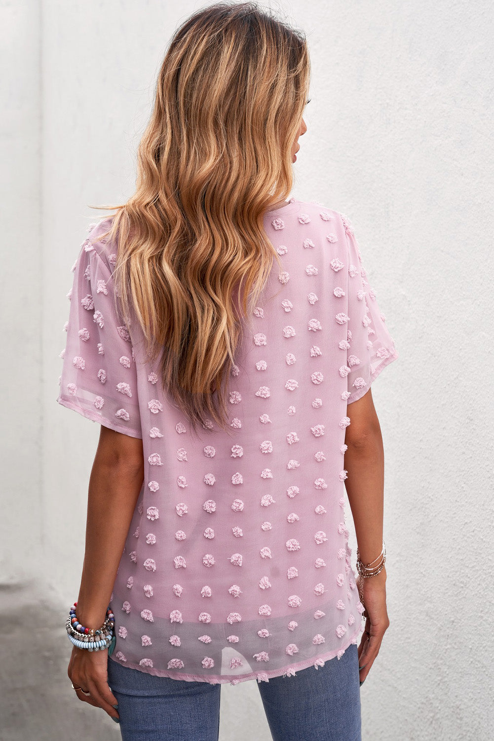 Blusa con cuello redondo y lunares suizos