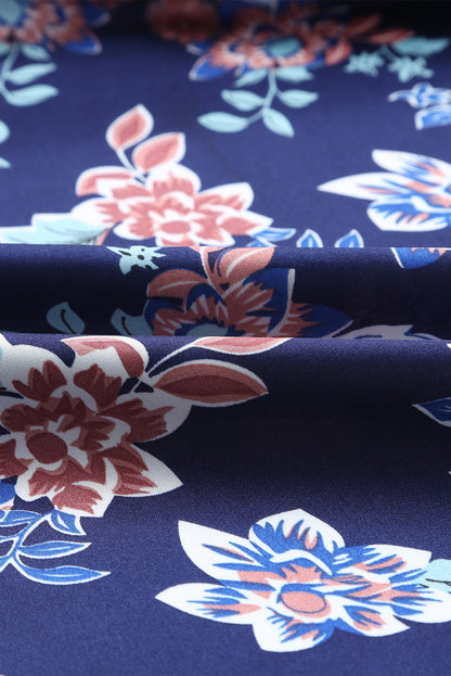 Robe longue bleue à imprimé floral avec nœud sur le buste et fente