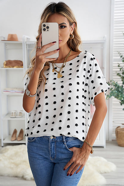 Blusa con cuello redondo y lunares suizos